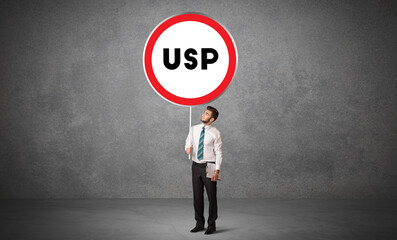 Young business person holdig traffic sign