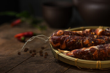 Homemade saussage in bamboo plate - such saussages are one of the favorite preserved food in winter prepared for the lunar new year in family and market