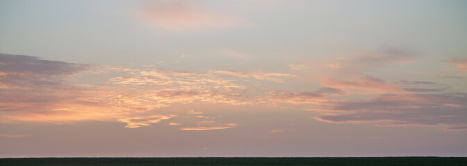 Naklejka na ściany i meble Pastel colors clouds on sunset background