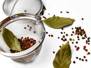 Colorful mixed pepper grains and flakes, isolated on white background, top view