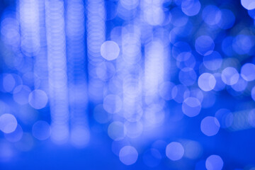 Festive background, blue lights of a Christmas garland