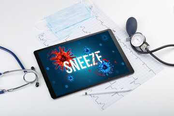 Tablet pc and doctor tools on white surface