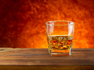 whiskey on the rocks on a wooden table