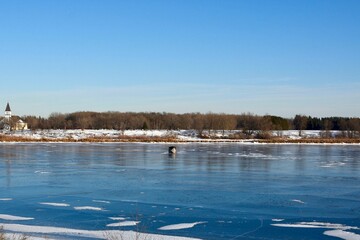 Winter in Manitoba - ice fishing on a river
