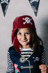 portrait of adorable little girl in pirate costume