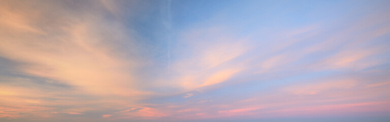 Clear blue sky with glowing clouds. Soft sunlight. Dramatic cloudscape. Concept art, meteorology, heaven, peace, graphic resources, picturesque panoramic scenery