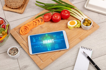 Tablet Pc with fruits, medical concept