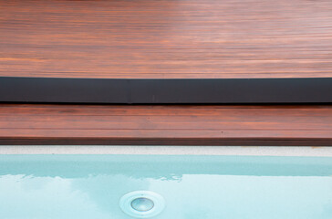 Detail of swimming pool coping and cover constructed by cumaru wood deck