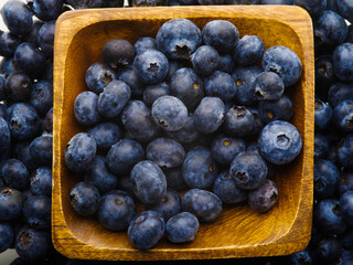 Close-up. Blueberries in a bowl. High angle view. Vitamins, antioxidants. Cooking, confectionery, sauces. Advertising. Restaurant, hotel, cafe, confectionery. There are no people in the photo.