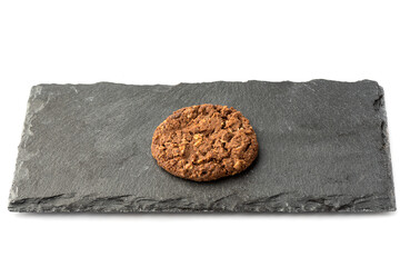 Chocolate granola cookies on a stone board for serving.