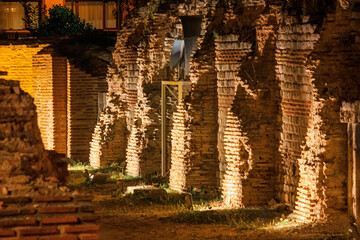Night view of the ruins of thermae of ancient Roman Odessos in the light of searchlights, in the...