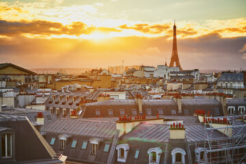 Beautiful Parisian skyline with roofs and dramatic sunset