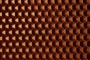 Cropped shot of milk chocolate texture background, horizontal view, honeycomb pattern. Food, dessert, textures concept. 