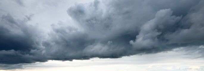Ornamental clouds. Dramatic sky. Epic storm cloudscape. Soft sunlight. Panoramic image, texture,...