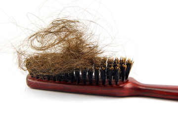 Hair loss concept, damaged hair on brush