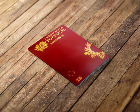 Portuguese passport on the top of a wood background