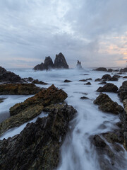 Wave water flowing around Camel Rock, NSW, Australia.