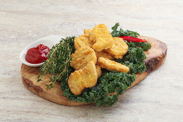 Crispy chicken nuggets with tomato ketchup
