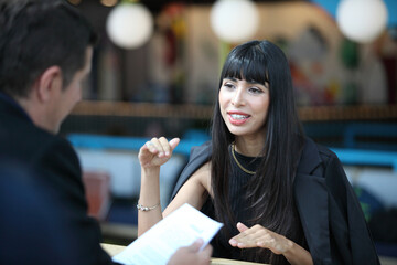 Businesswoman and businessman HR manager interviewing woman. Candidate female sitting interviewers on background. Human resources,Young attractive woman during job interview