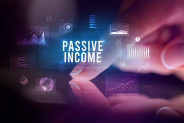 Finger touching tablet with business graphs and icons concept