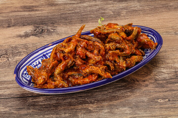 Canned anchovy in tomato sauce