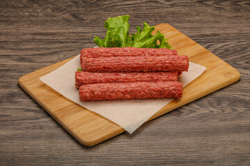 Raw beef sausages with spices