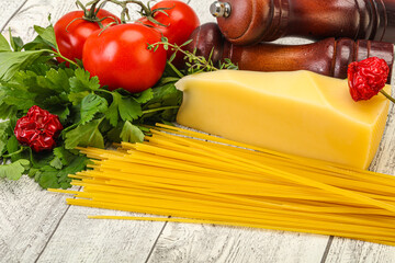 Raw Italian spaghetti heap with cheese