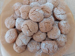 Delightful fresh-baked Spiced biscuits with butter sugar flour eggs ground nutmeg cloves mixed spice butter. Topped with icing sugar  