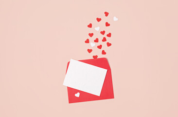 Hearts confetti and red envelope over pink background. Love, saint valentine day, mothers day,...