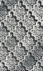 White stone laced ornament of the building facade