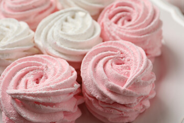 Delicious white and pink marshmallows on plate, closeup