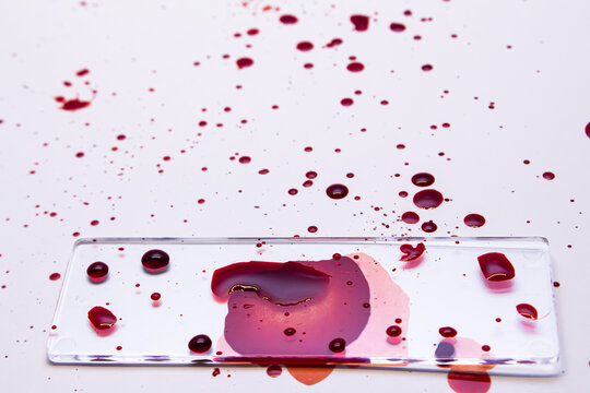 glass with blood splattered with white background
