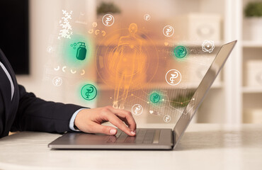 Doctor working on laptop with healthcare concept