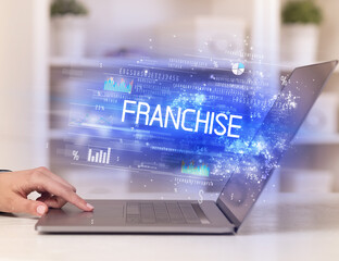 Closeup of businessman hands working on laptop