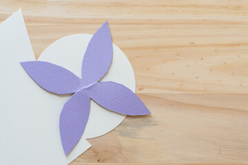 background with floral-like design on paper and wood