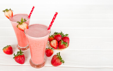 Strawberry yogurt fruit juice smoothie pink colorful fruit juice milkshake blend beverage healthy high protein the taste yummy In glass drink episode morning on white wood background.