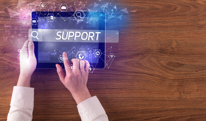 Close-up of a tablet searching inscription