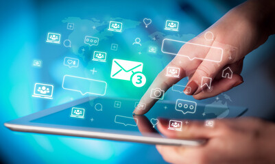 Close-up of a hand using tablet, social media concept