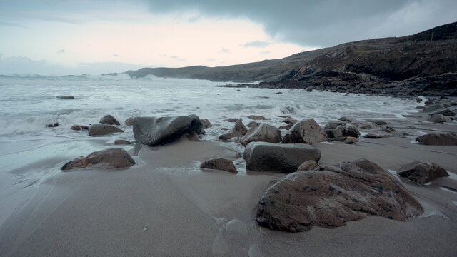 rocky beach and surf at sunset on a beach in Donegal, Ireland. wild atlantic way.