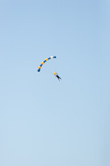 Skydiver Flying in Blue Sky.Vertical Image.Copy Space