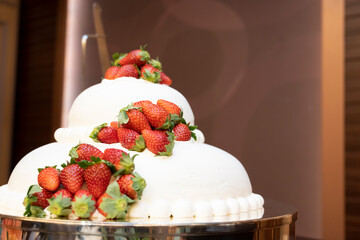 A cake full of strawberries in the shape of a kamakura