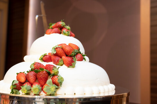 A cake full of strawberries in the shape of a kamakura