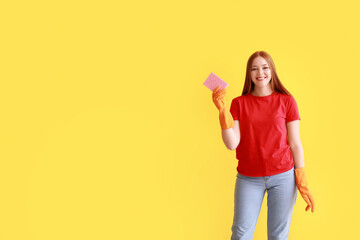 Young woman with sponge on color background