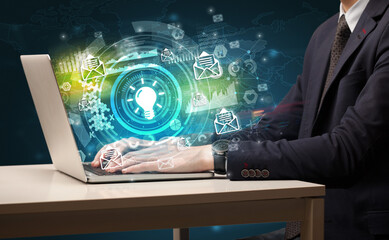 Business hand typing on a modern laptop