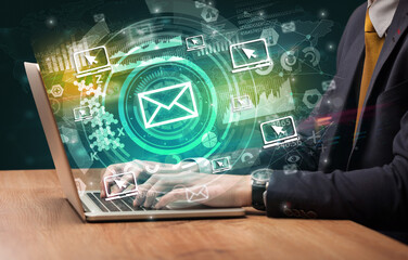 Business hand typing on a modern laptop