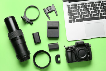 Flat lay of photo equipment on green background