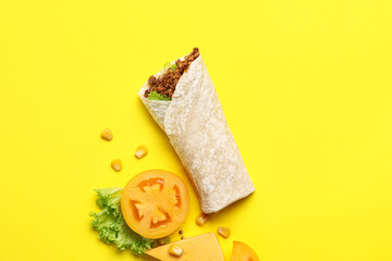 Tasty burrito on yellow background