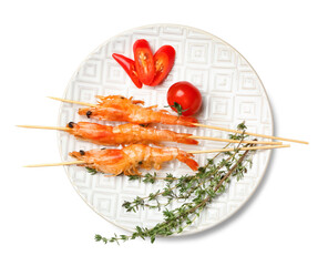 Plate with grilled shrimp skewers on white background
