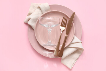 Stylish table setting on pink background