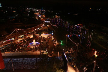aerial view on the ferris wheel over the fair at night